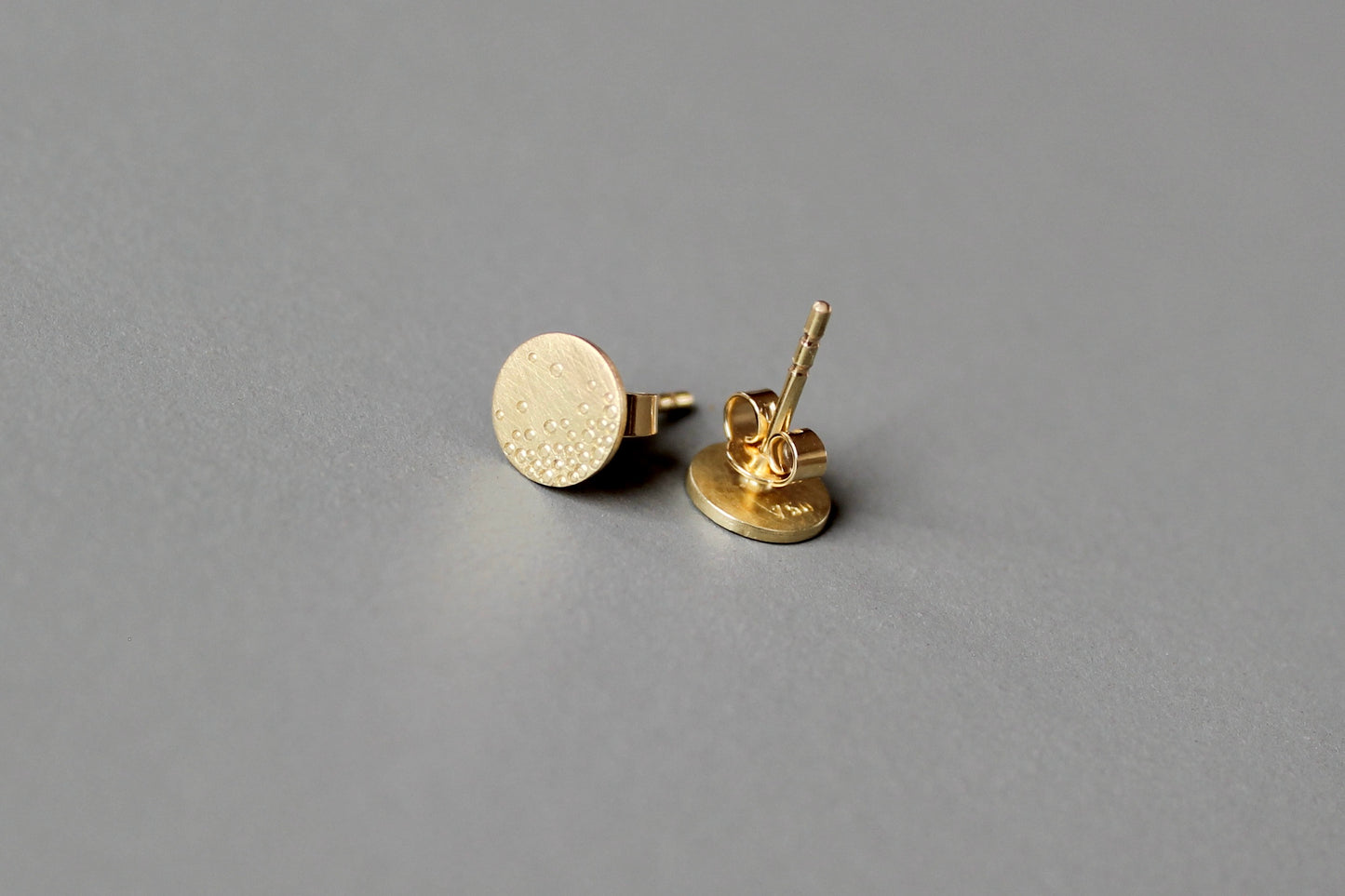 dainty golden ear studs with bubbles design