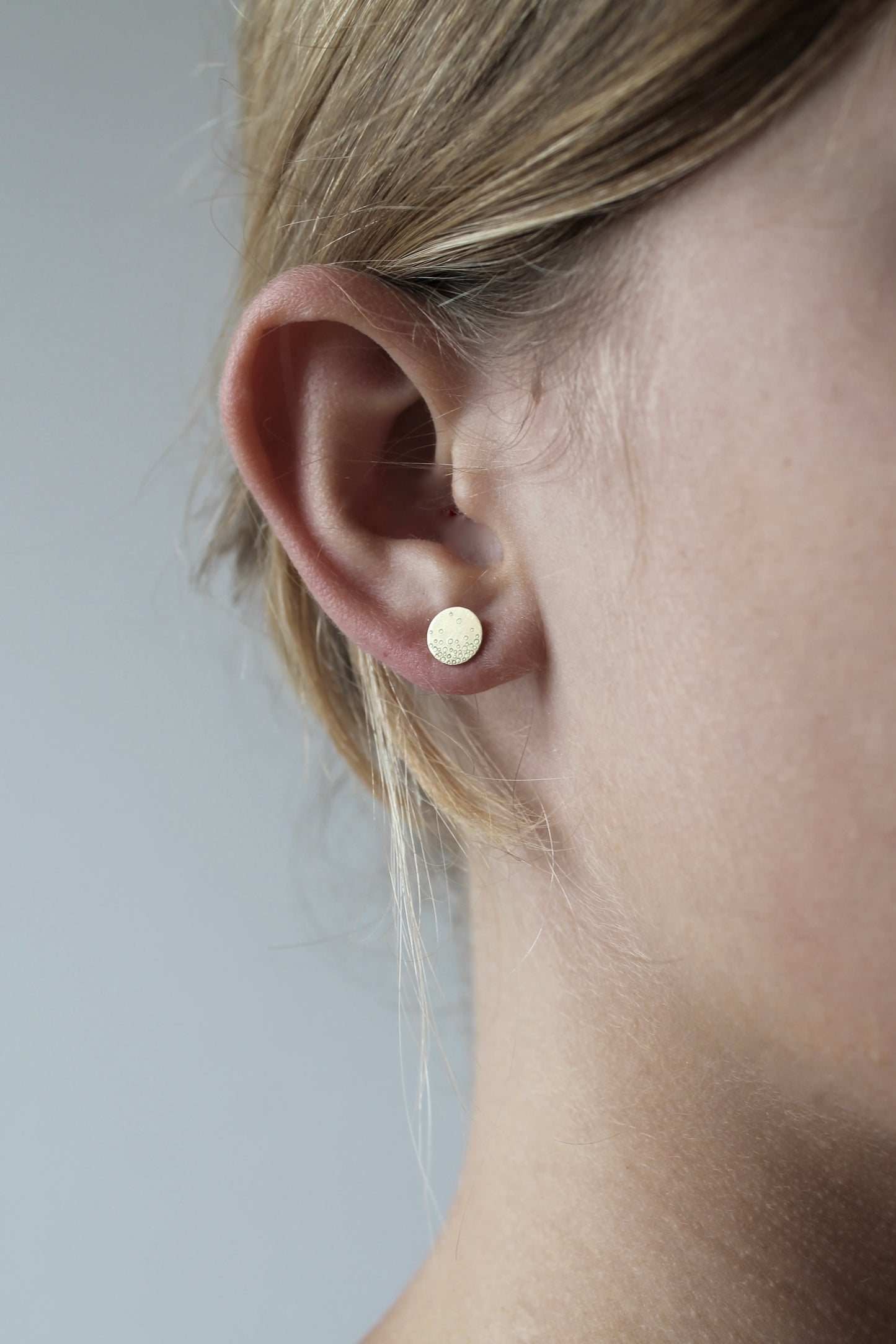 dainty golden ear studs with bubbles design