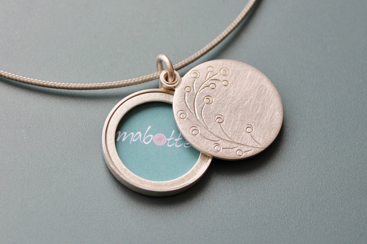 romantic handmade photo locket with twig in sterling silver