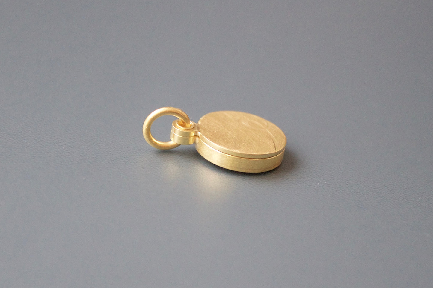 minimalist initial locket made from 18 ct gold