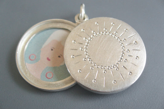 modern two photos locket with sun design in sterling silver