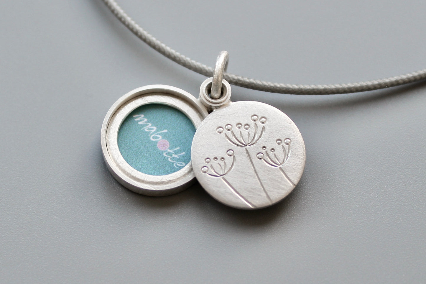 small floral locket for one picture in sterling silver