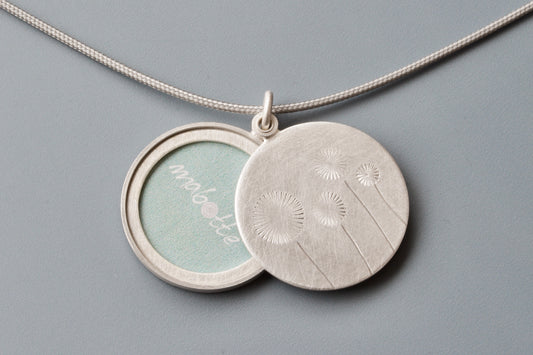 lovely locket for one photo with four dandelions