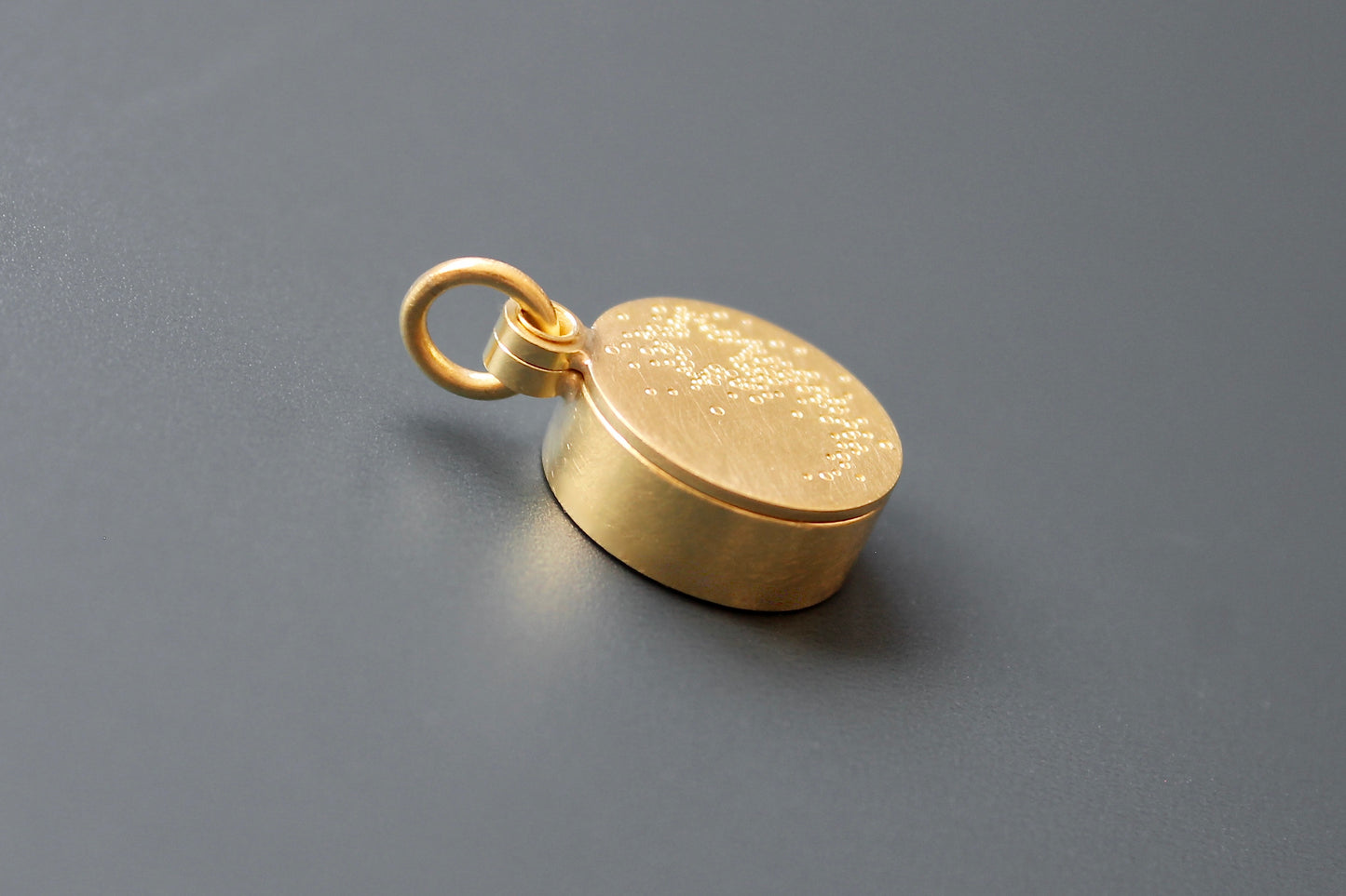 golden floating locket with shooting star
