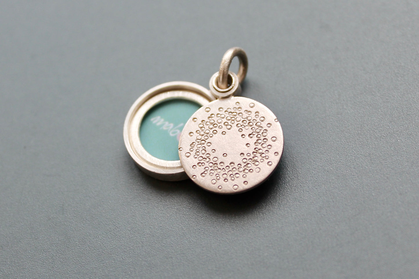 small mabotte locket for one photo in sterling silver with 1000 dots design