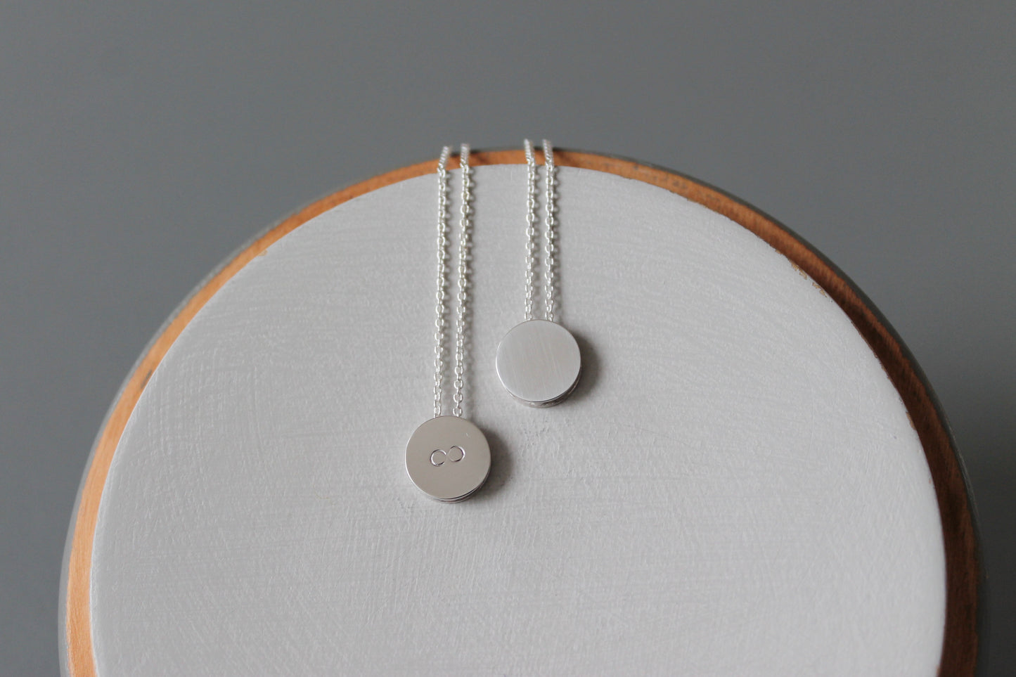 tiny pendant necklace in sterling silver with infinity symbol