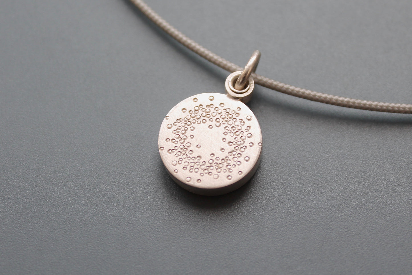 small mabotte locket for one photo in sterling silver with 1000 dots design