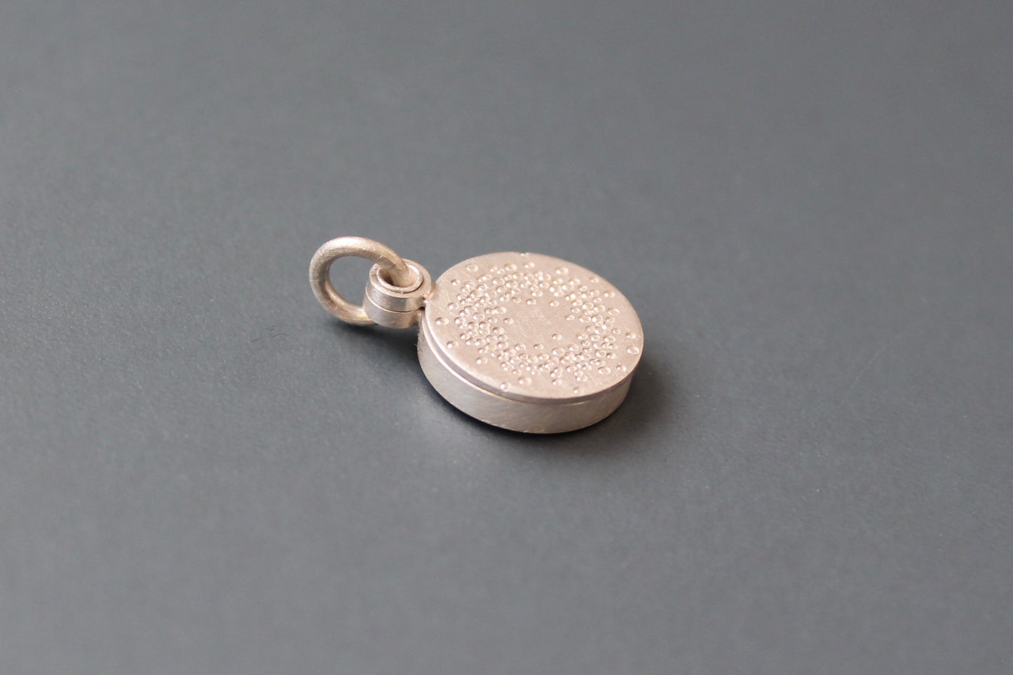 small mabotte locket for one photo in sterling silver with 1000 dots design
