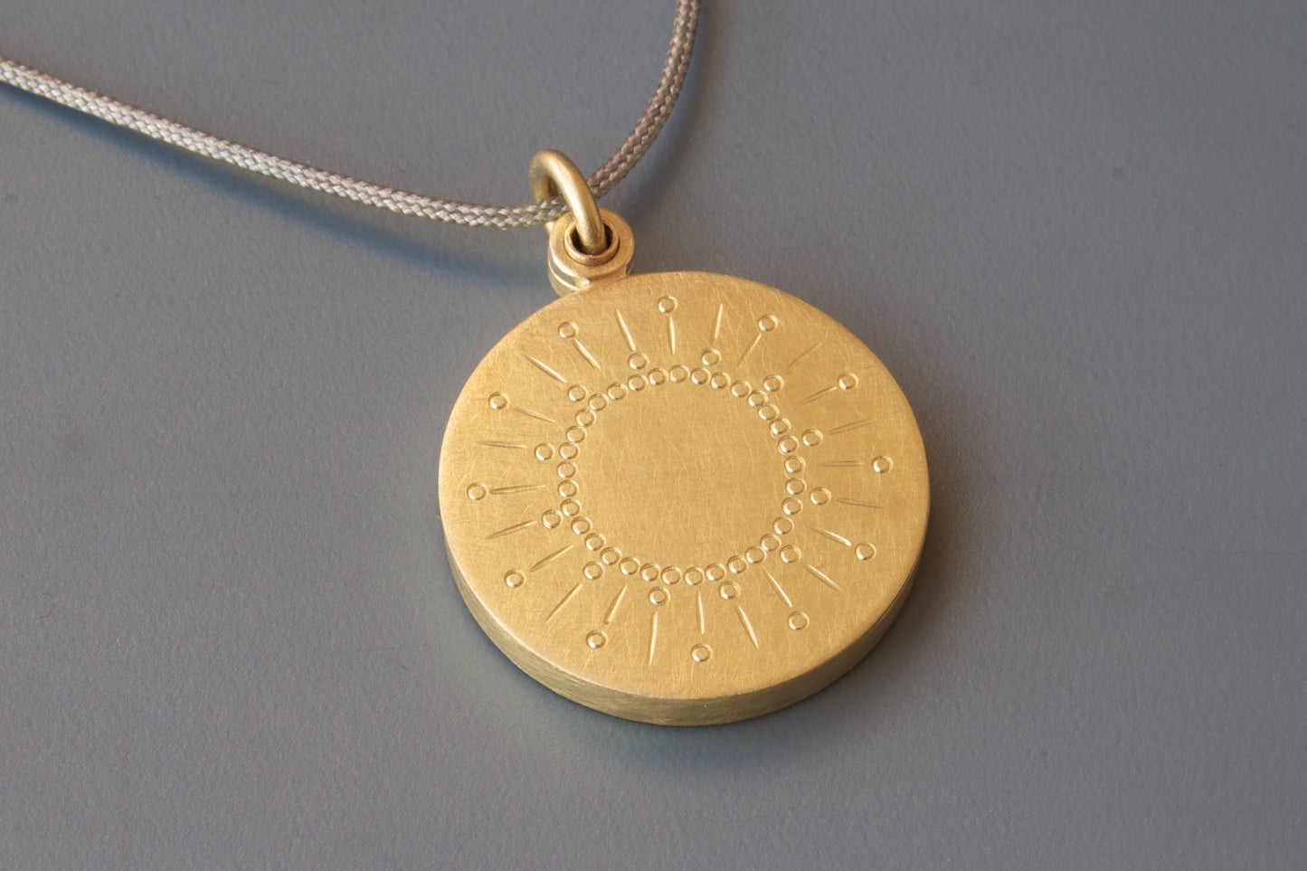 beautiful golden sun locket for one photo