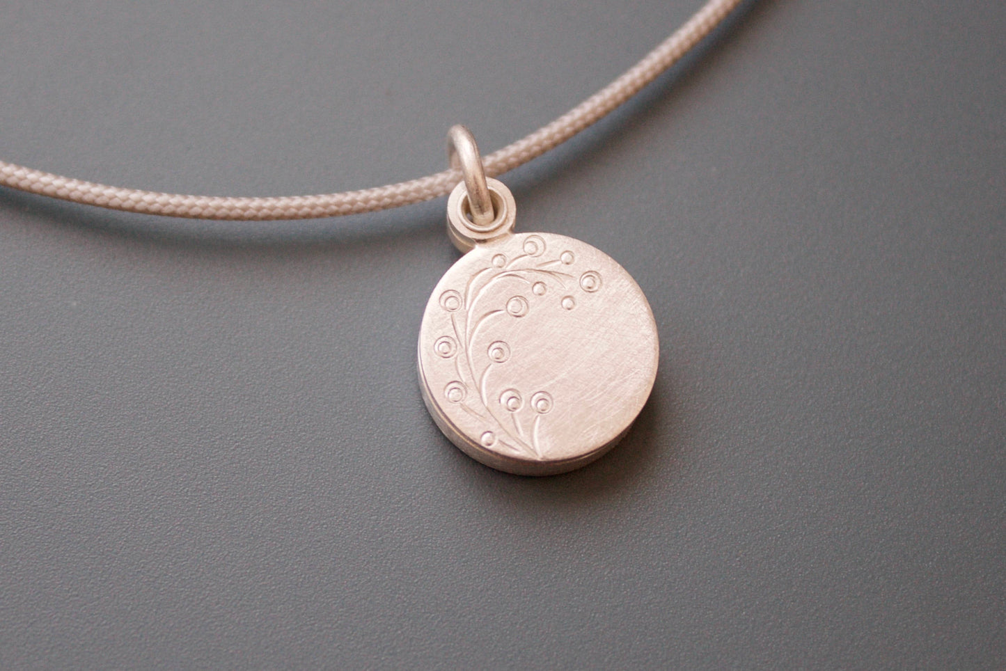 dainty round photo pendant with delicate twig in sterling silver