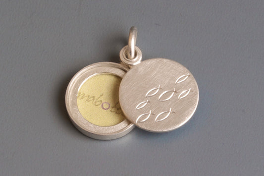 small sterling silver locket for one photo with school of fish