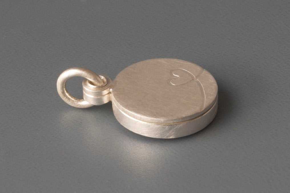 charming silver photo locket with little heart design