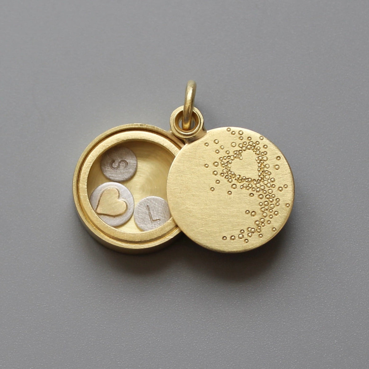 Living locket with engraved heart with custom initial plates in 18ct solid gold