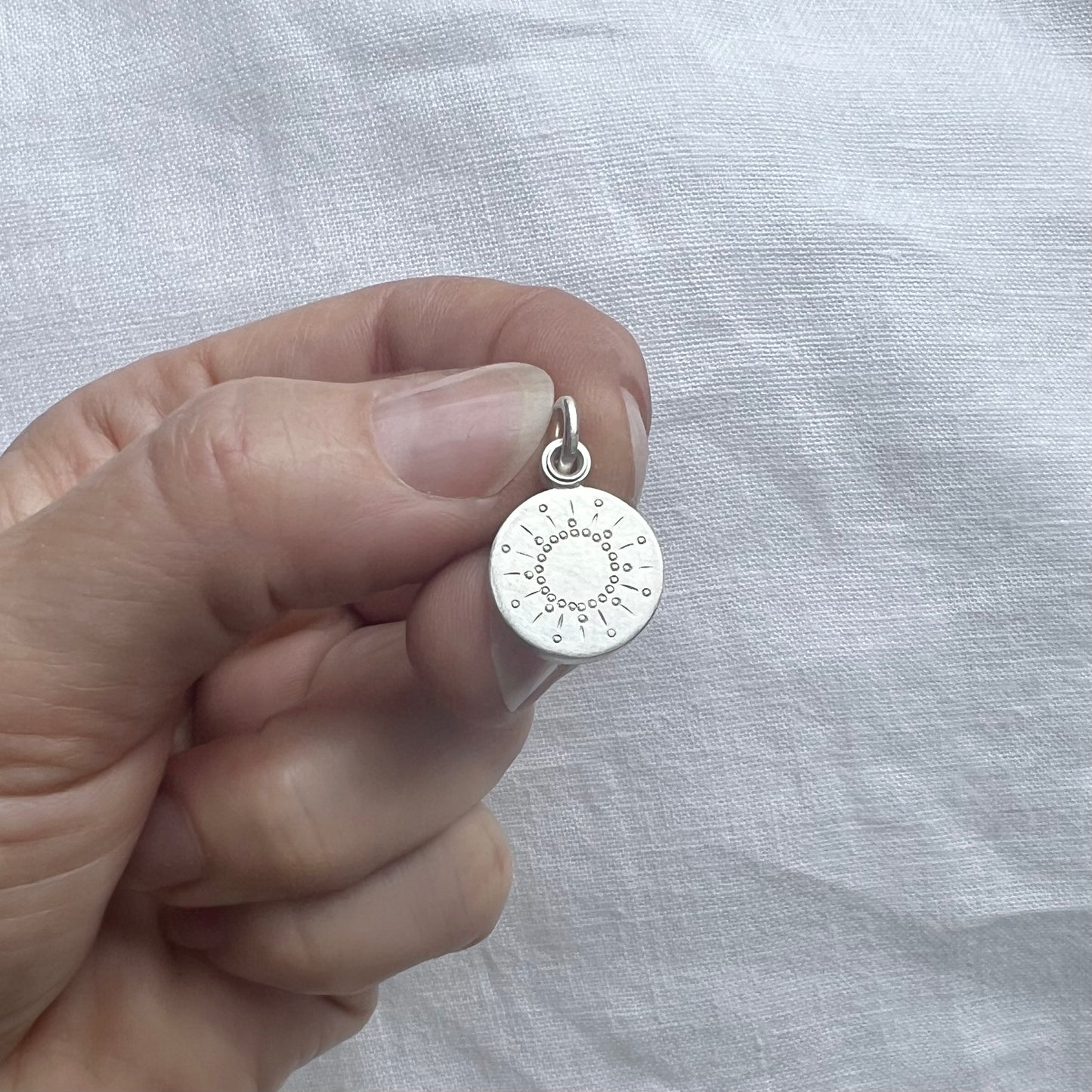 tiny silver picture locket with sun design