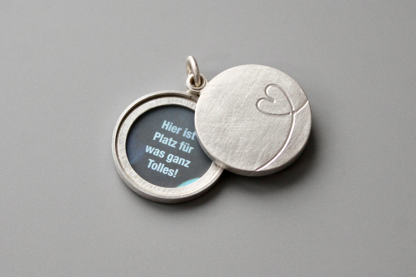 cute silver double locket with heart design