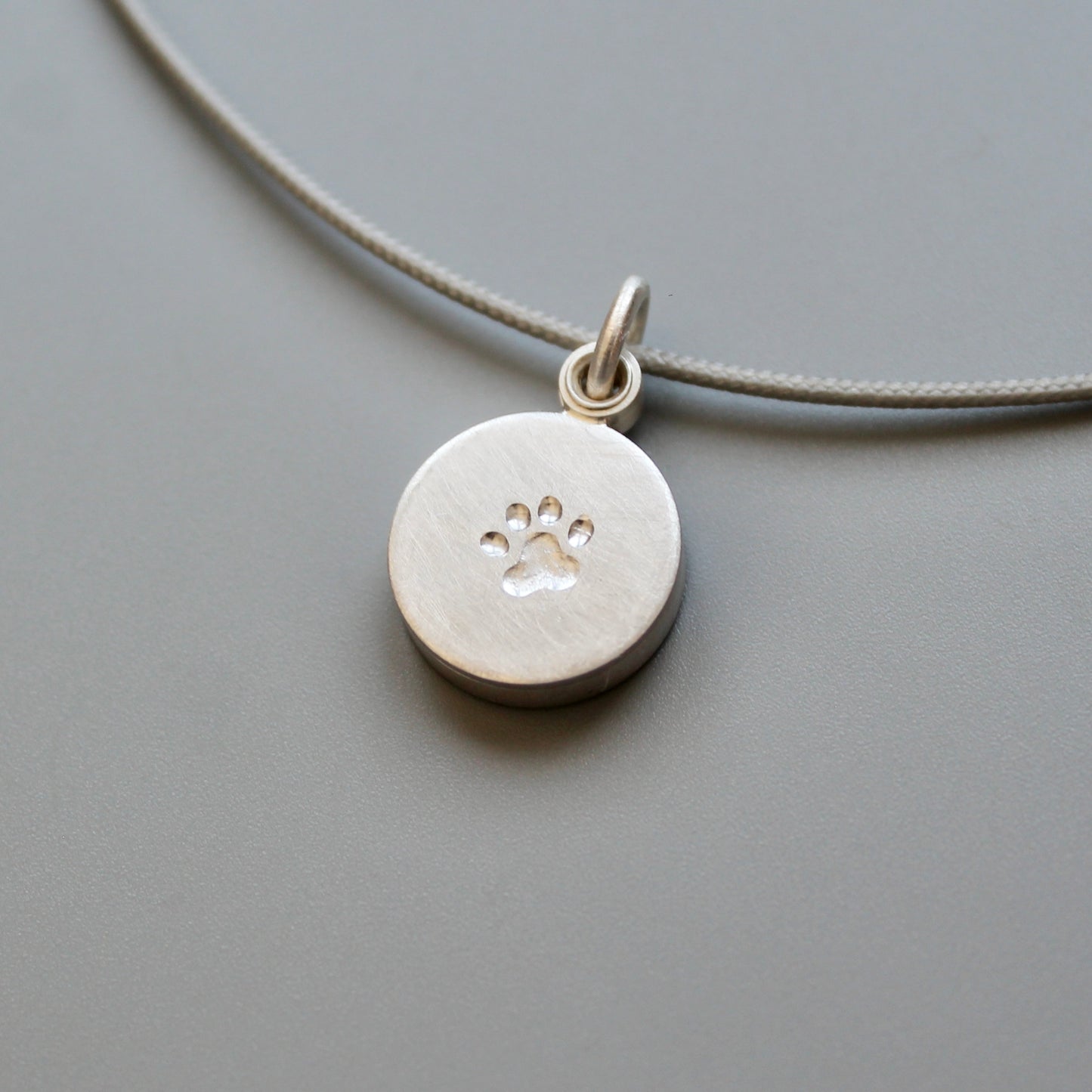 small paw locket in sterling silver for dog lovers