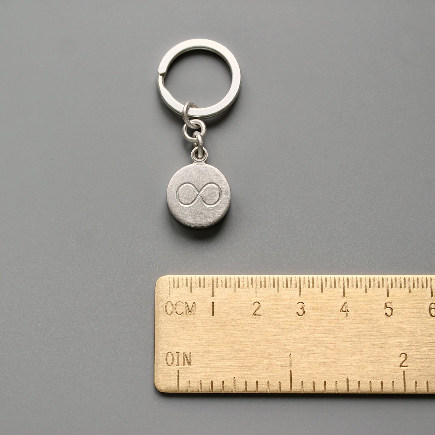 solid sterling silver keychain locket with infinity sign for one photo