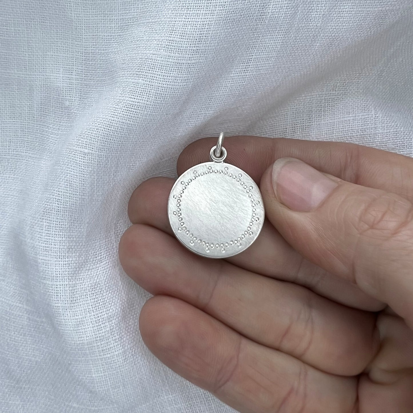 modern silver photo locket with delicate lace pattern