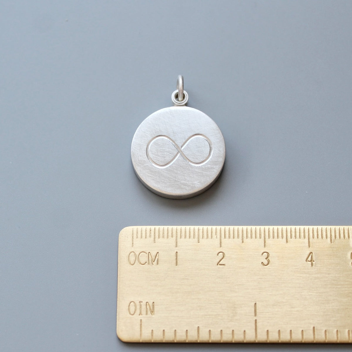 minimalist infinity locket for one picture in sterling silver