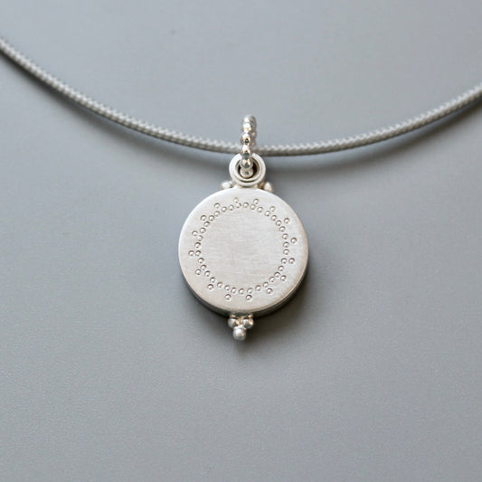 small silver photo locket with dainty lace design