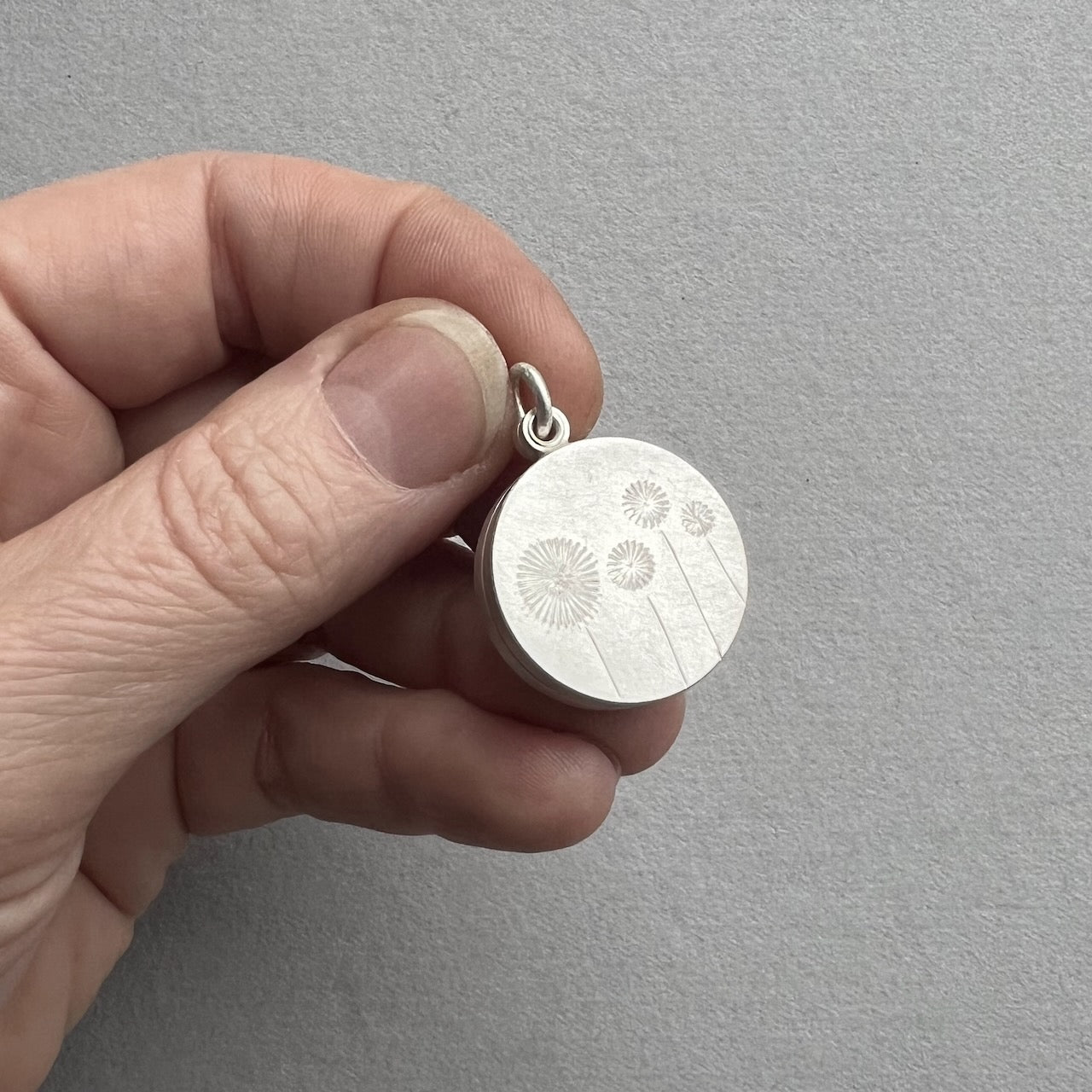 sterling silver floating dandelion locket filled with stamped letter plates