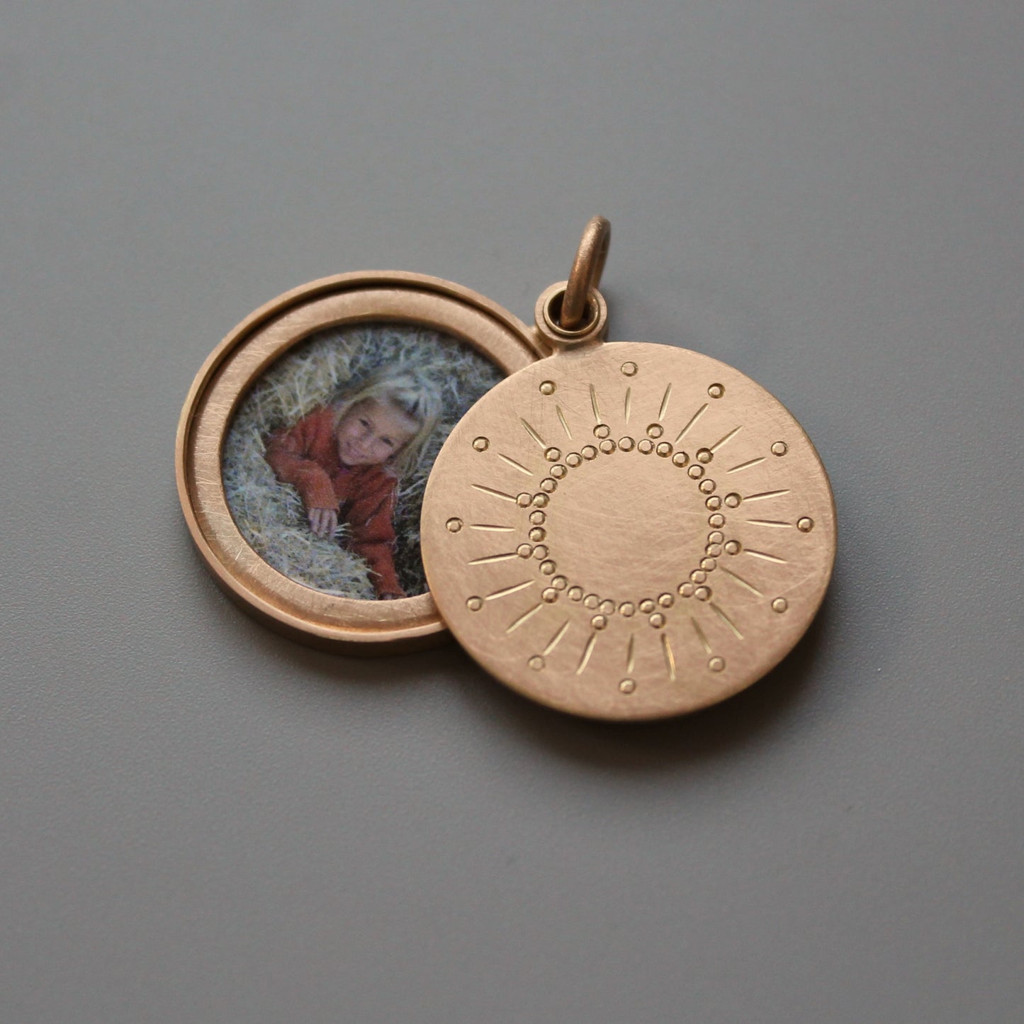 rosegold photo locket with sun design
