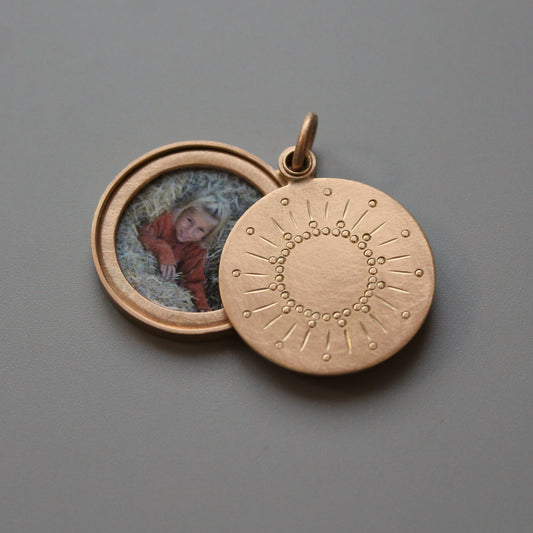 rosegold photo locket with sun design
