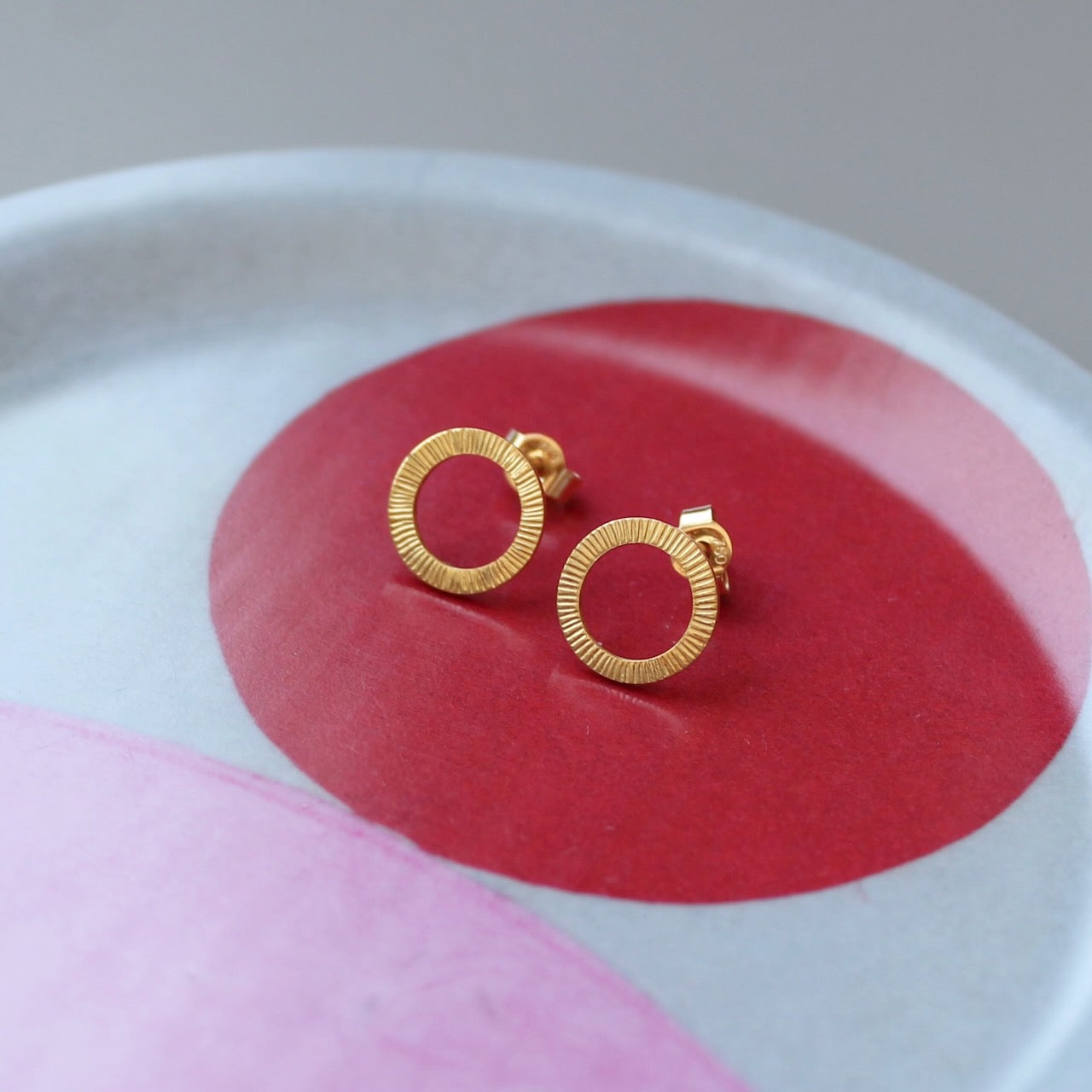 beautiful golden ear studs with hammered surface