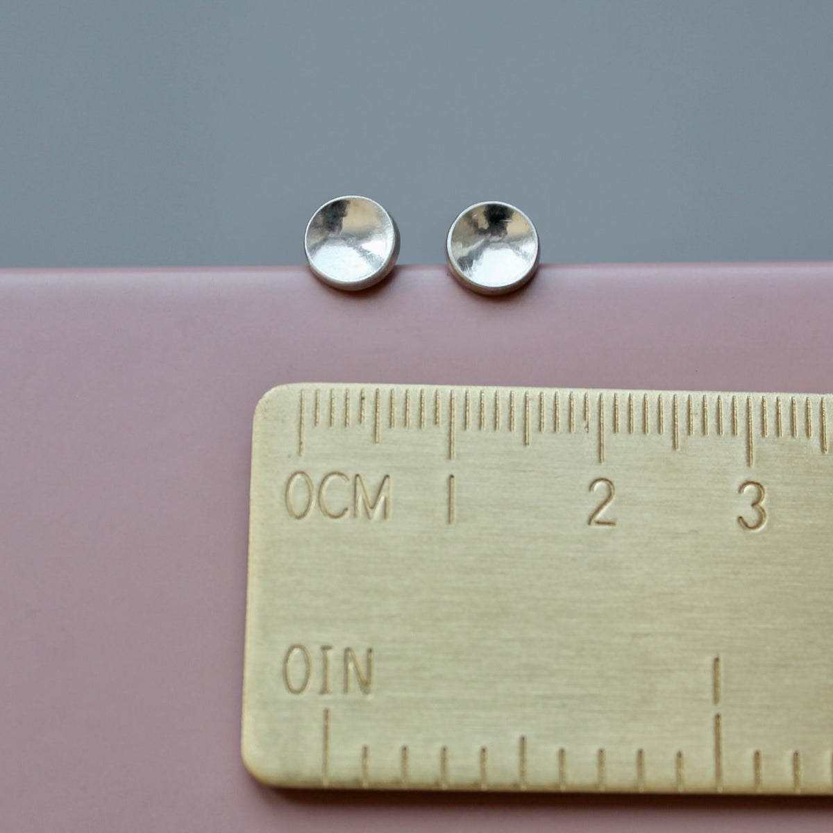 round elegant ear studs in polished sterling silver