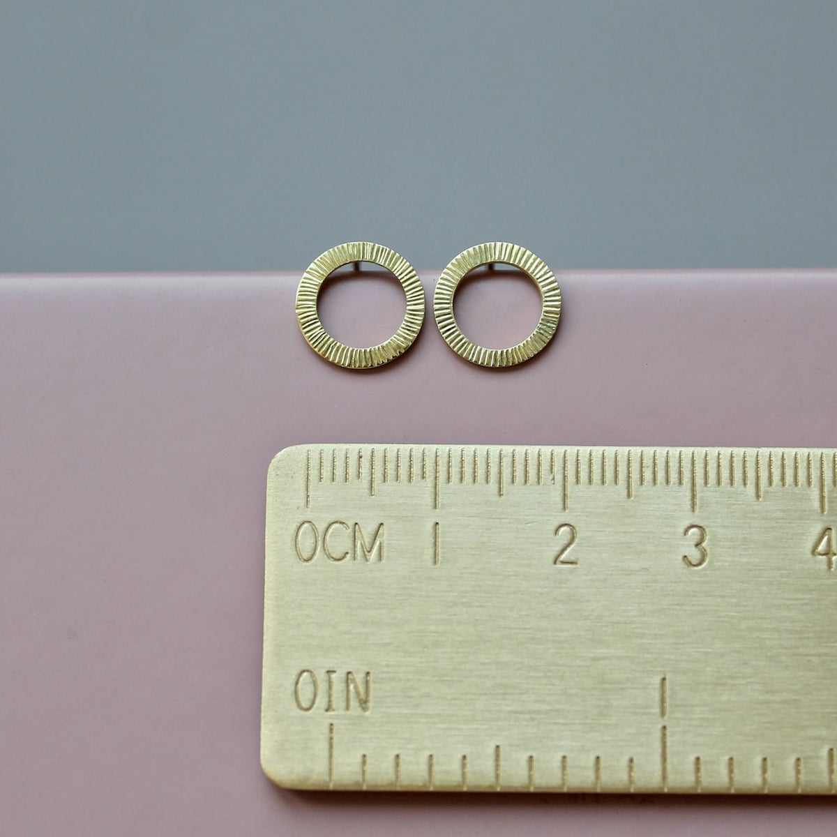 beautiful golden ear studs with hammered surface