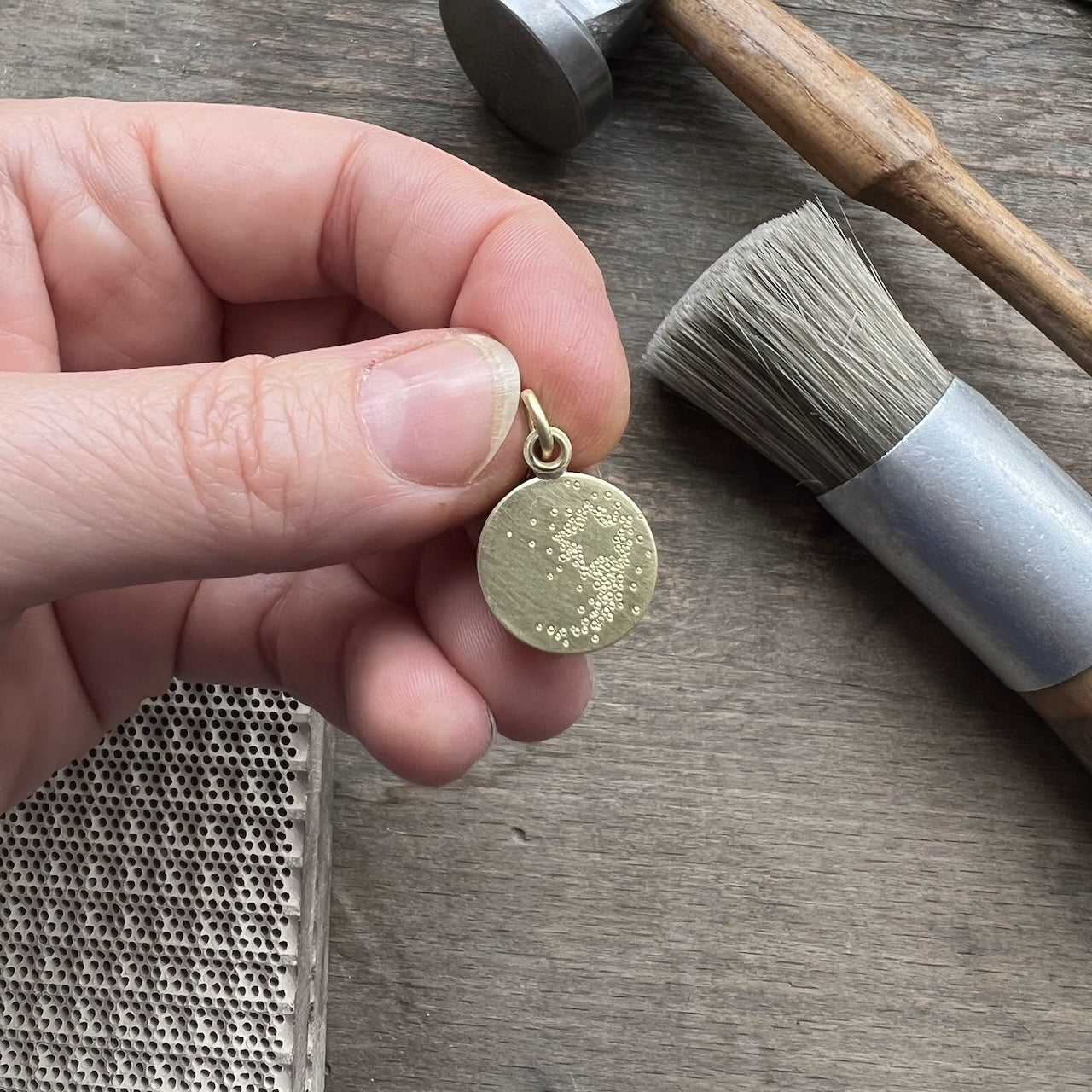 golden floating locket with shooting star