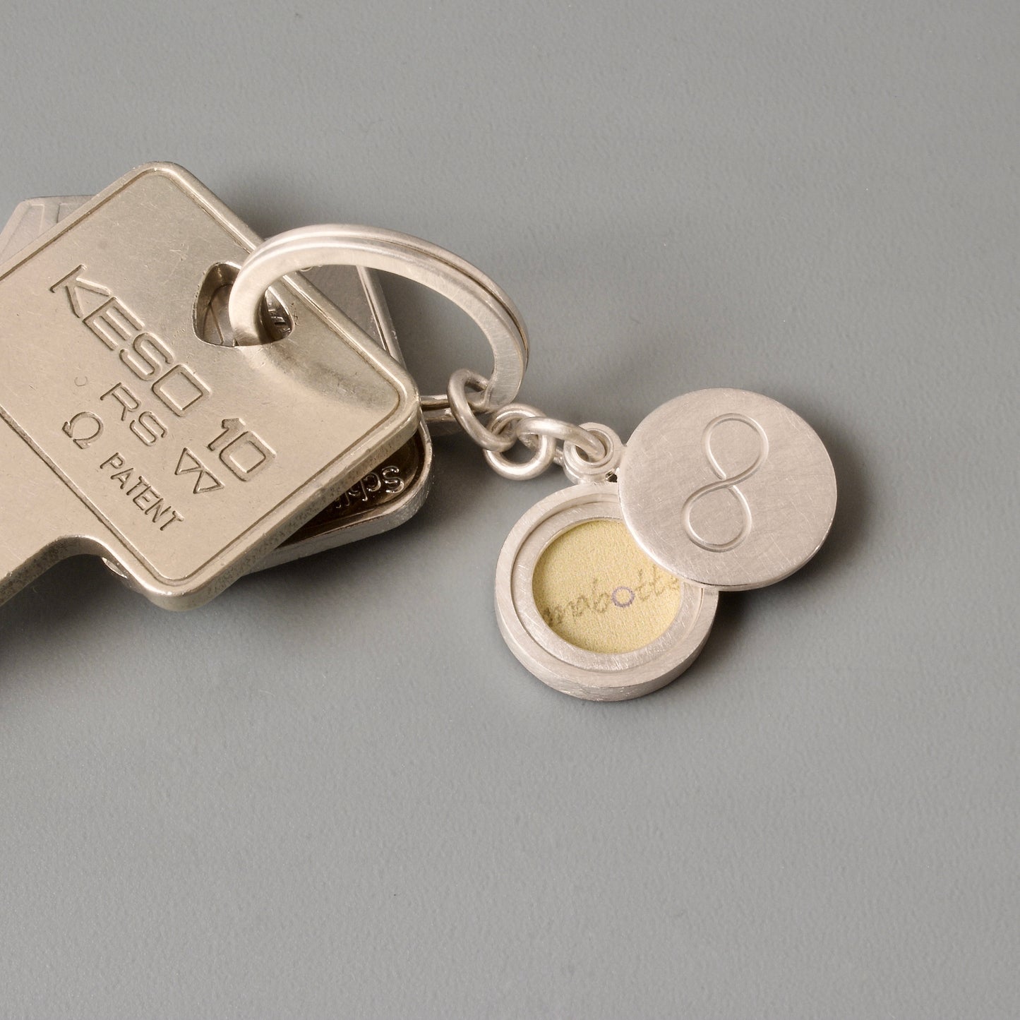 solid sterling silver keychain locket with infinity sign for one photo