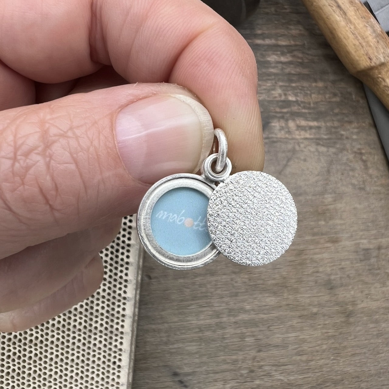 minimalist modern locket for a small photo in structured sterling silver