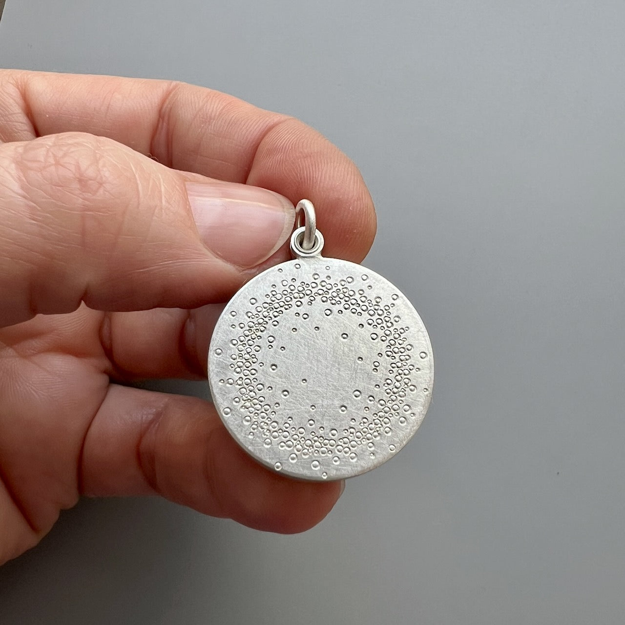 unique sterling silver glass locket filled with sun moon and stars