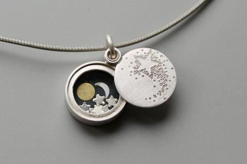 small silver locket Sun Moon and Stars with shooting star locket