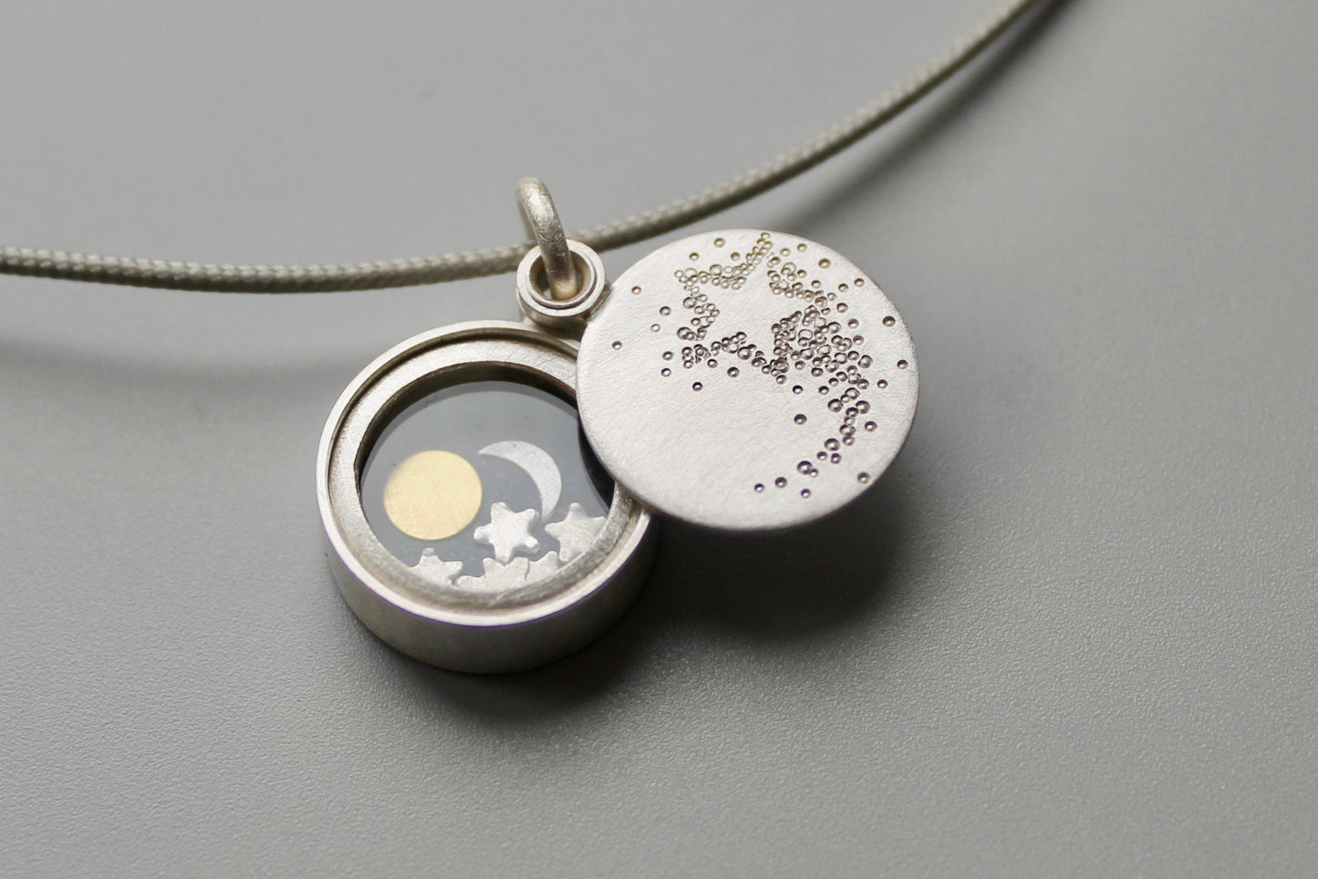 small silver locket Sun Moon and Stars with shooting star locket