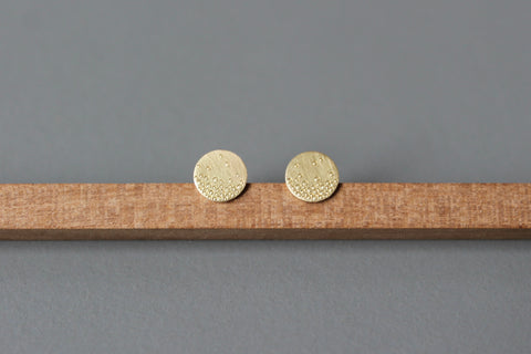 dainty golden ear studs with bubbles design