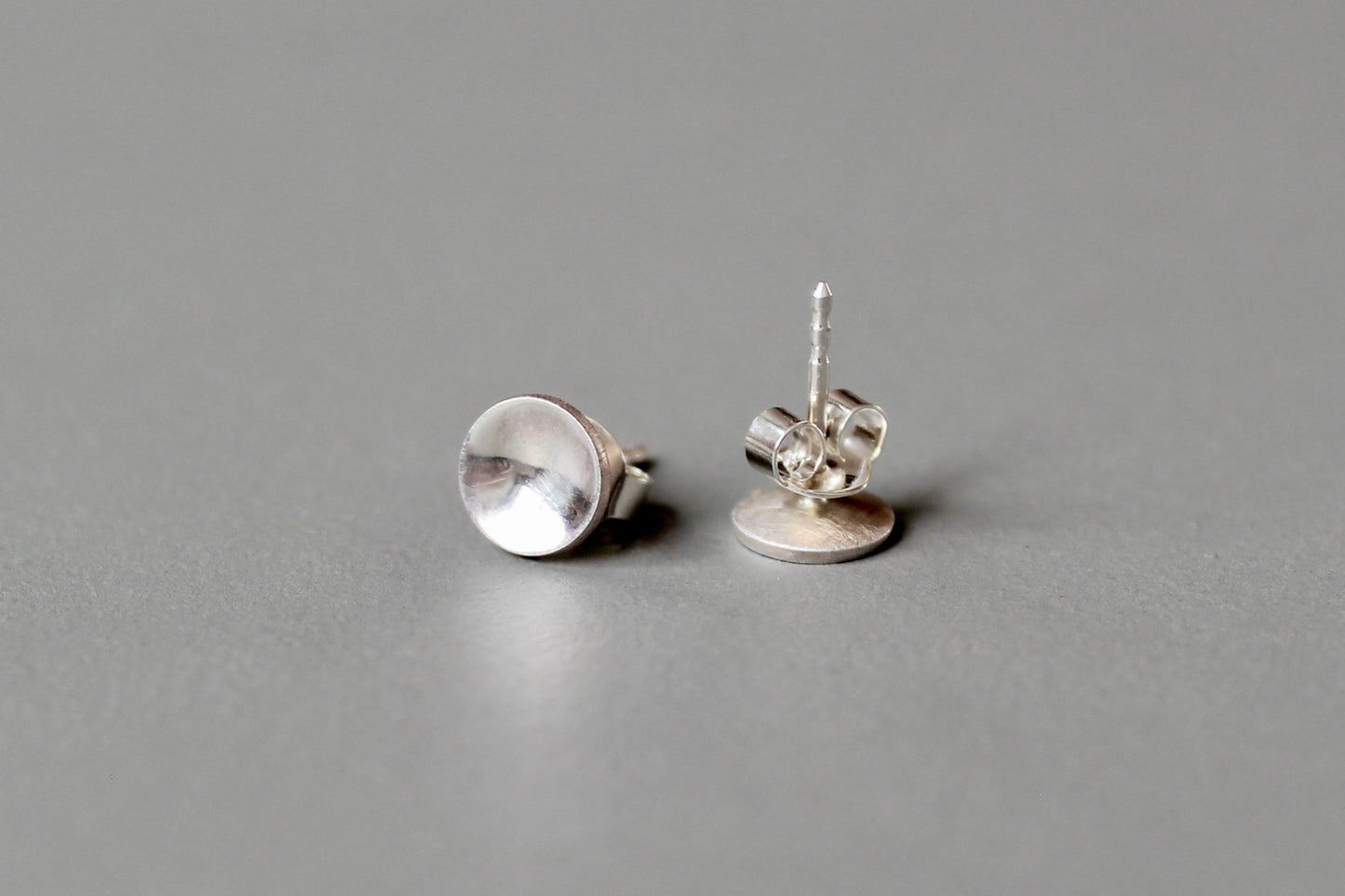 round elegant ear studs in polished sterling silver