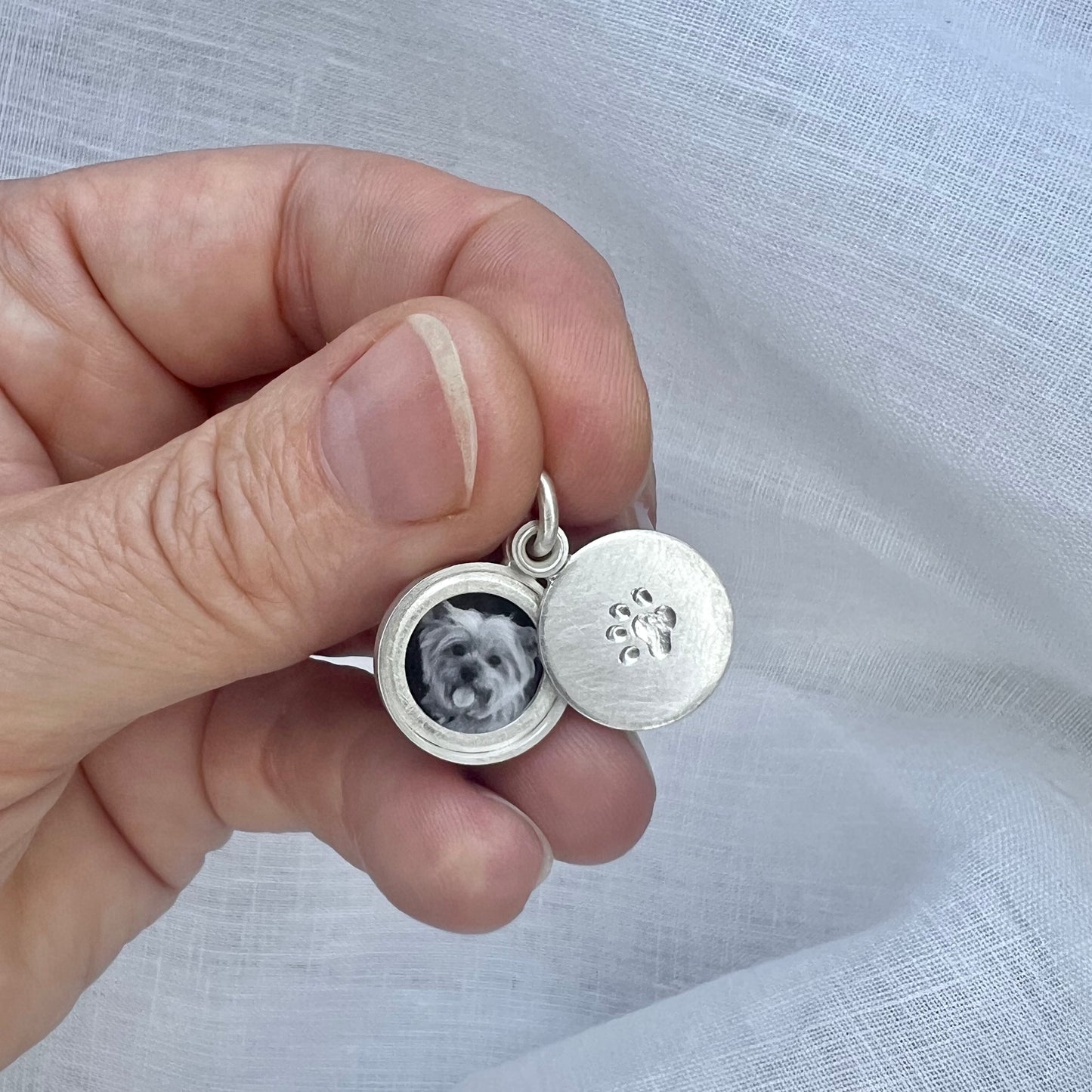 small paw locket in sterling silver for dog lovers