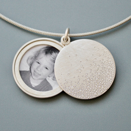 modern photo locket in sterling silver with bubbles design