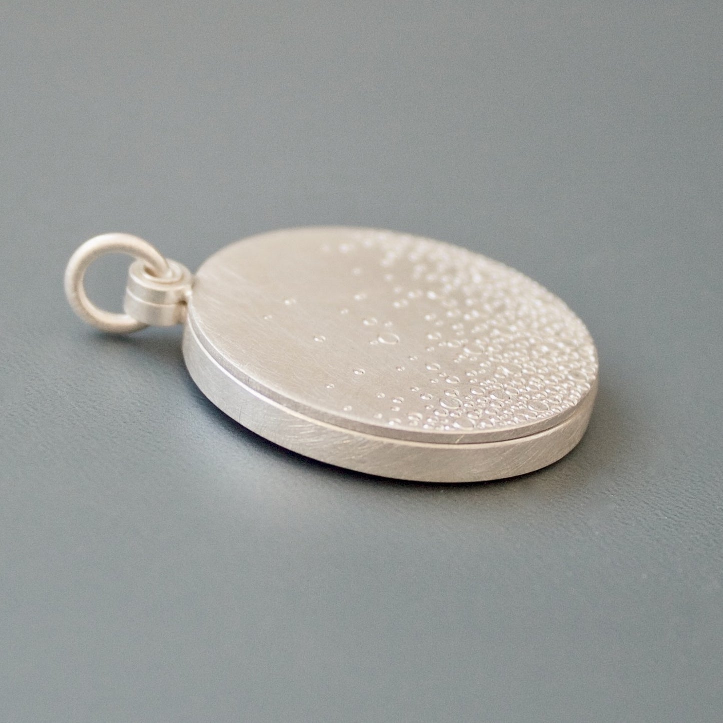 modern photo locket in sterling silver with bubbles design