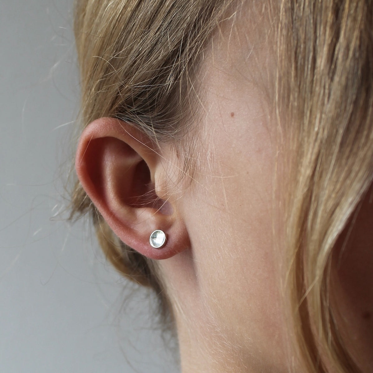 round elegant ear studs in polished sterling silver