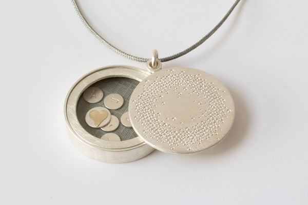 personalized glass locket in sterling silver with 1000 dots design