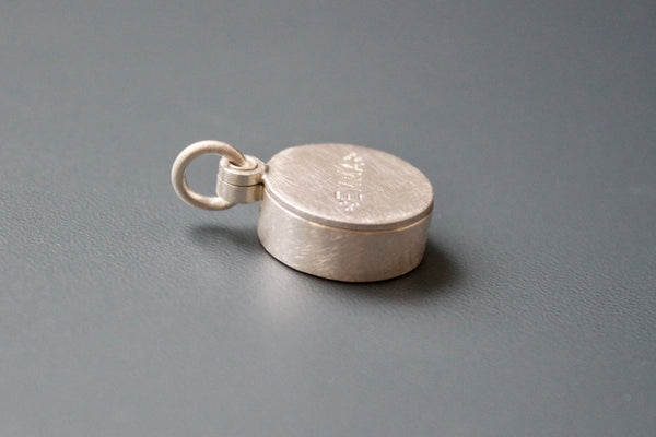 silver floating locket with custom name with forget me not seeds