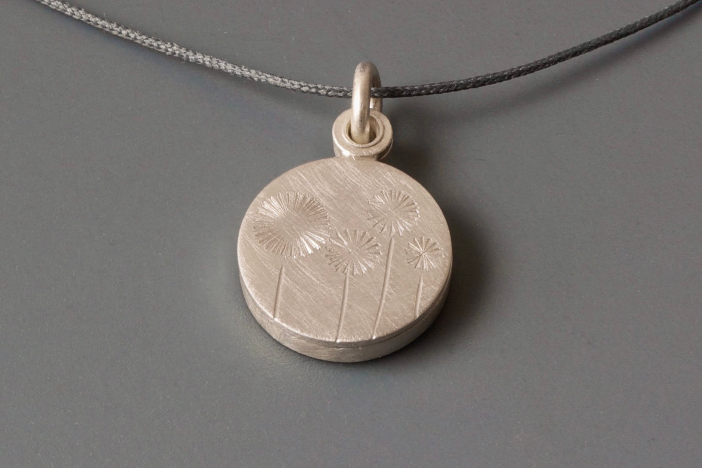 small locket with four dandelions for one photo handmade in sterling silver