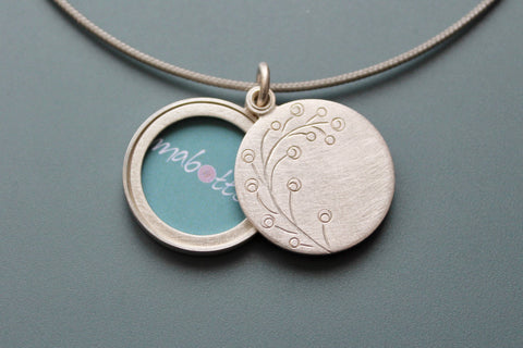 romantic handmade photo locket with twig in sterling silver