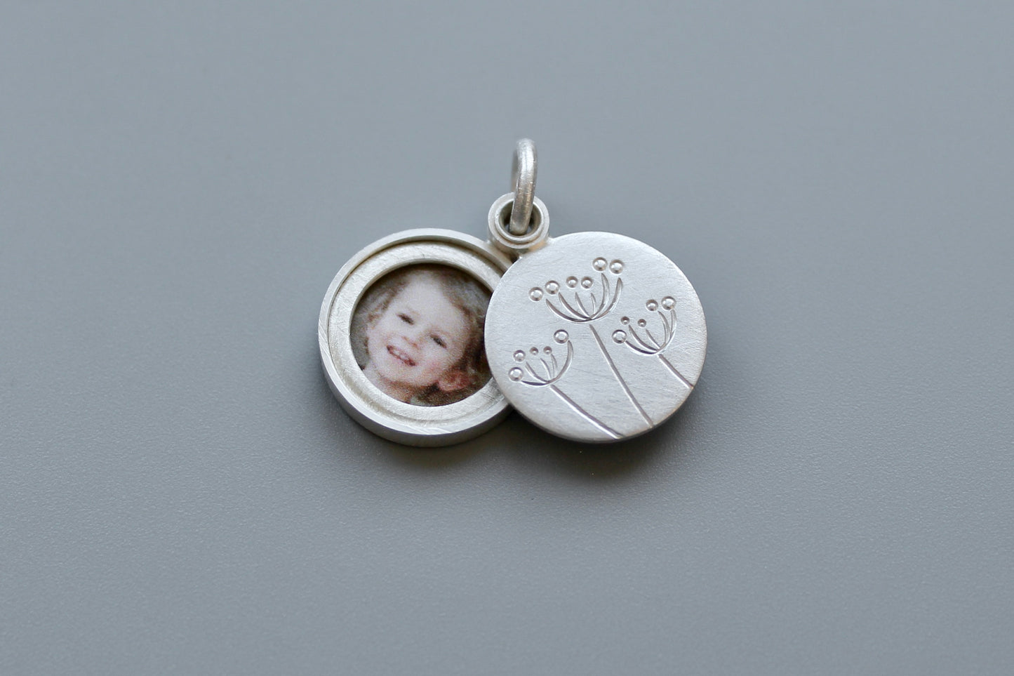 small floral locket for one picture in sterling silver