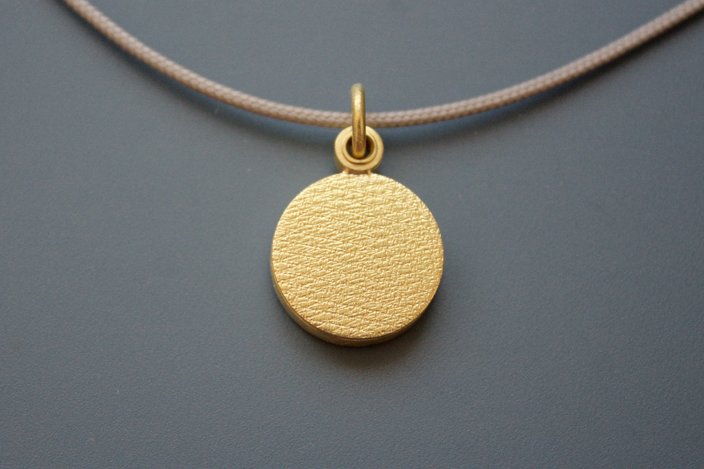 minimalist modern locket for a small photo in 18ct yellow gold