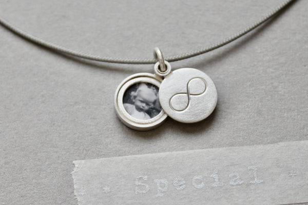 minimalist silver infinity locket for one picture