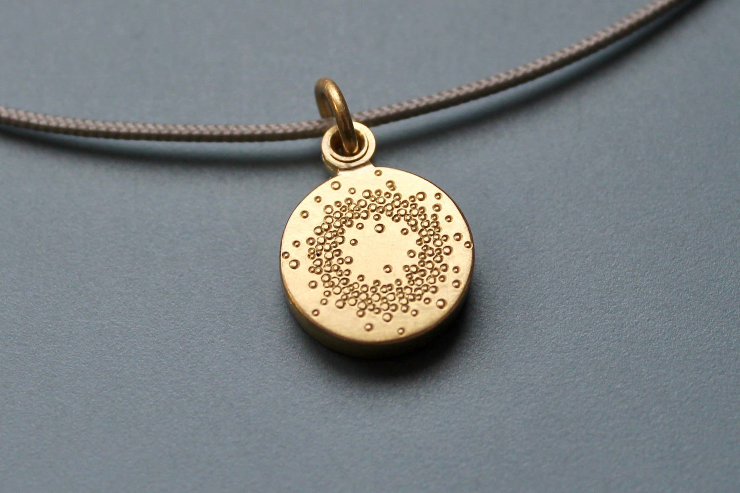 small golden locket for one picture with 1000 dots design
